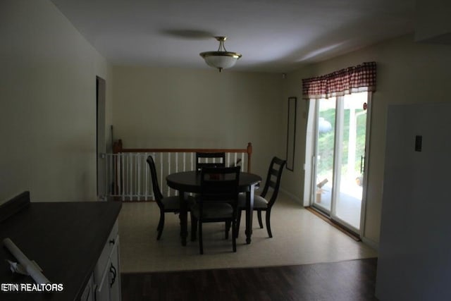 dining room with hardwood / wood-style flooring