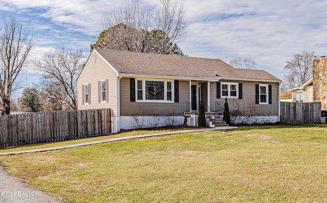 ranch-style home with a front yard