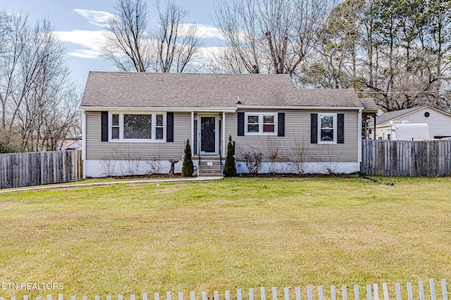 ranch-style house featuring a front lawn