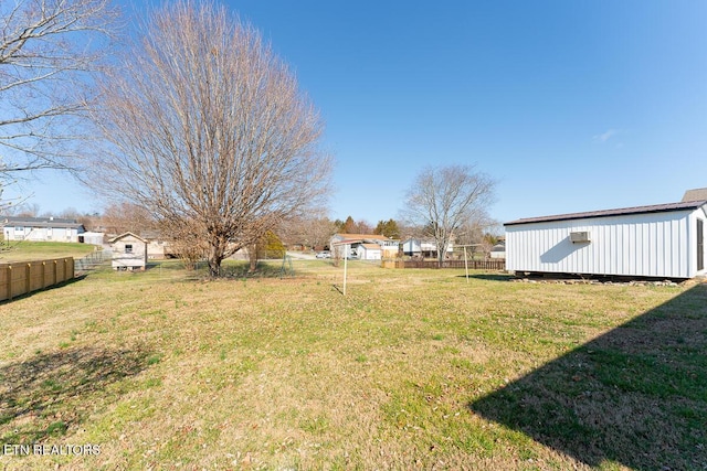 view of yard featuring a storage unit