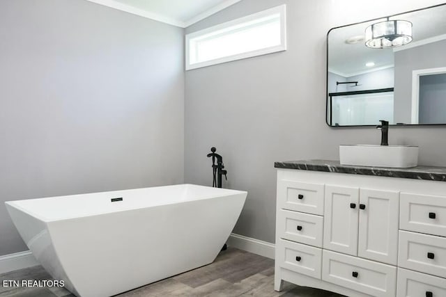 bathroom featuring vanity, plus walk in shower, wood-type flooring, and ornamental molding