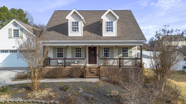 view of front of house featuring a garage and covered porch