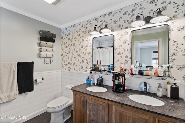 bathroom featuring tile patterned floors, vanity, toilet, and crown molding