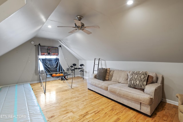 interior space with hardwood / wood-style flooring, ceiling fan, and lofted ceiling