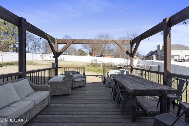 deck featuring outdoor lounge area and a yard