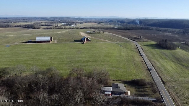 birds eye view of property featuring a rural view