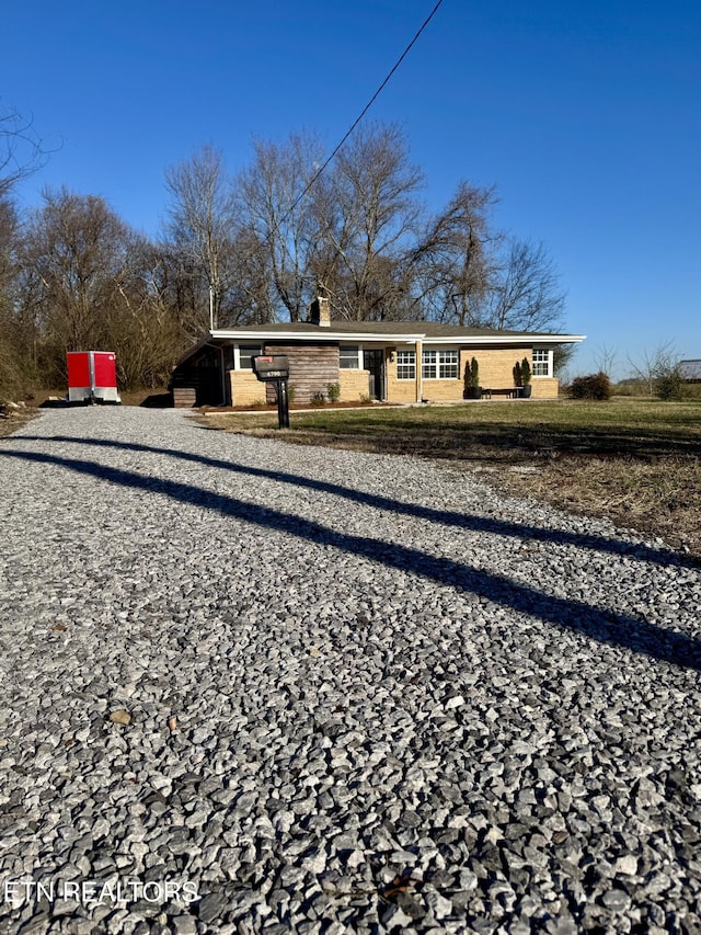 rear view of house featuring a carport