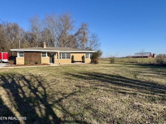 view of front of home with a front yard