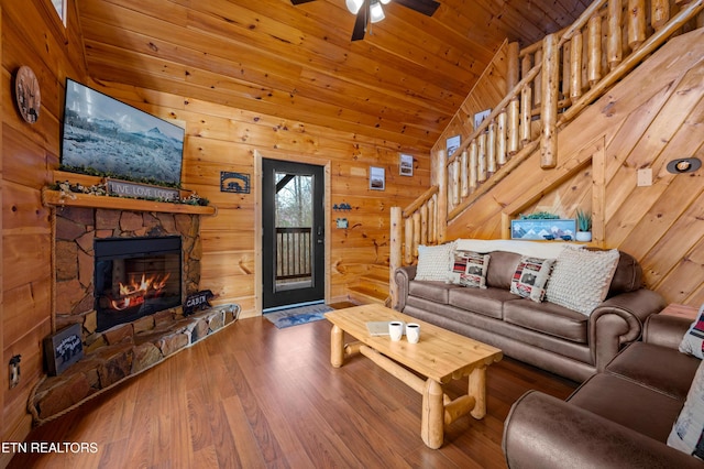 living room featuring a stone fireplace, high vaulted ceiling, wooden ceiling, hardwood / wood-style flooring, and ceiling fan