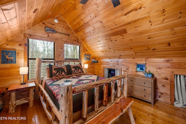 bedroom featuring wood-type flooring, wooden ceiling, ceiling fan, and vaulted ceiling