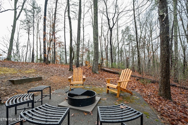 view of patio / terrace featuring an outdoor fire pit