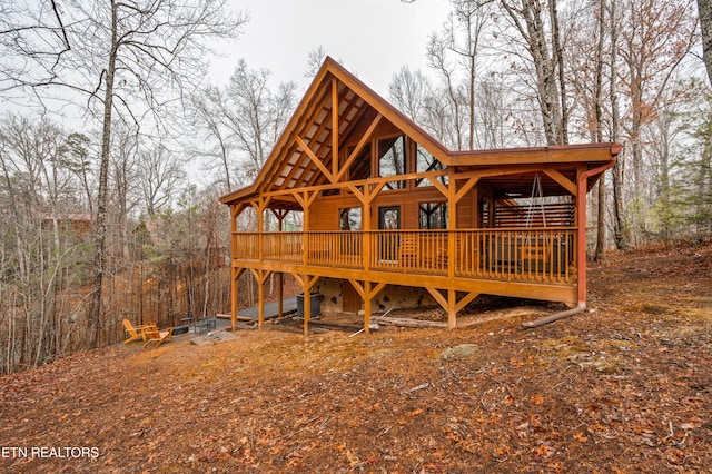 view of front of house featuring a wooden deck and central AC unit