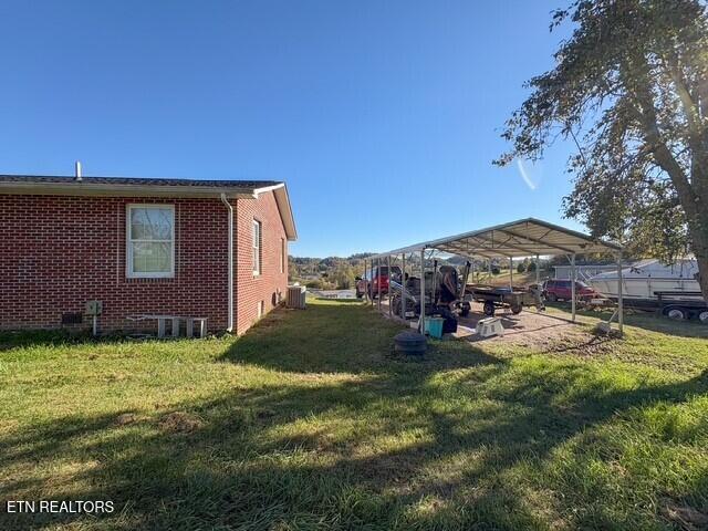 view of yard with a carport