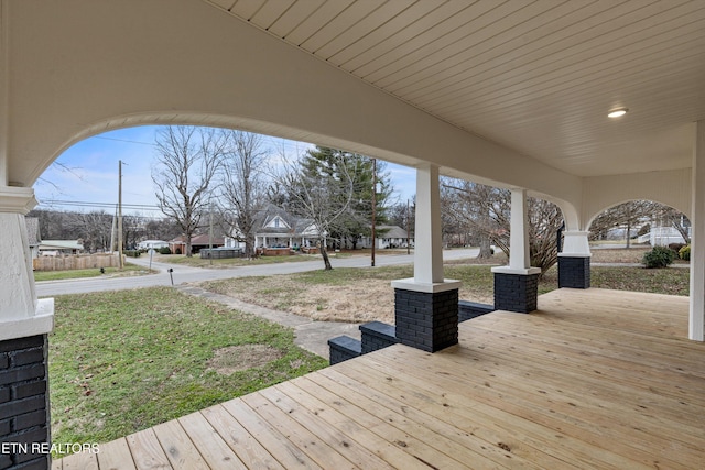 wooden terrace featuring covered porch