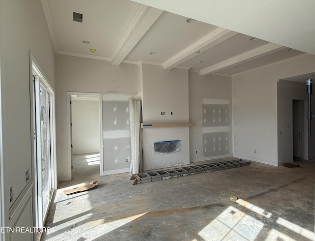 unfurnished living room with baseboards, ornamental molding, and beamed ceiling