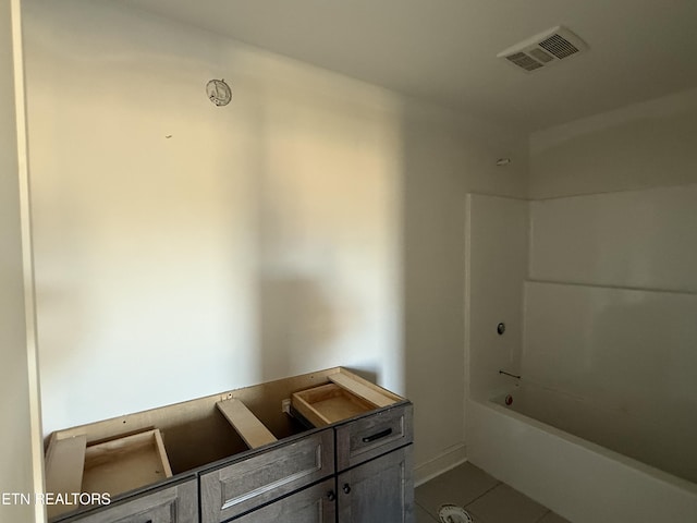 bathroom with visible vents, shower / bathtub combination, and tile patterned floors