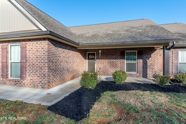 property entrance featuring a patio area