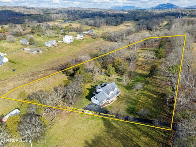 aerial view featuring a rural view and a mountain view