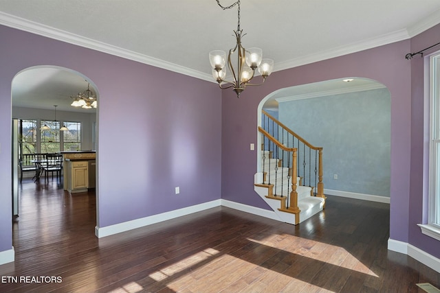 unfurnished room with a chandelier, arched walkways, baseboards, and dark wood-style floors