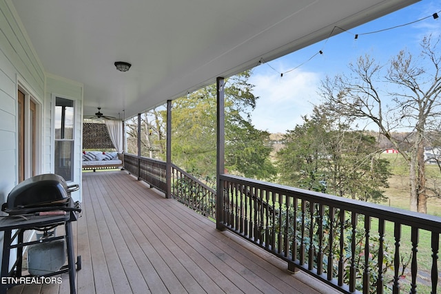 deck with ceiling fan and grilling area
