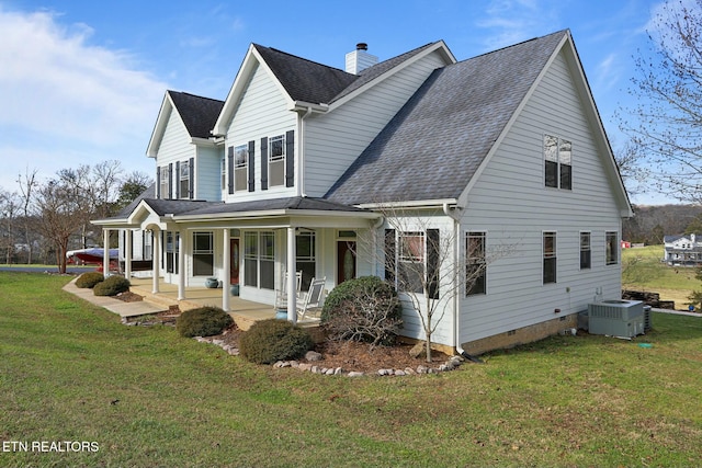 view of home's exterior with a yard, a porch, a chimney, and central air condition unit