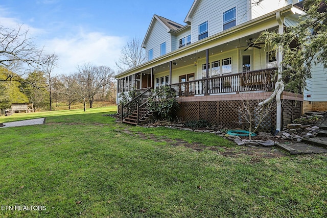exterior space with stairs, a porch, a front lawn, and a ceiling fan