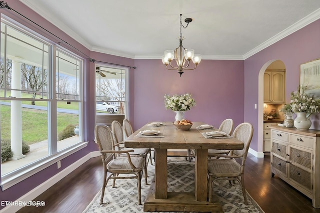 dining room with plenty of natural light, ornamental molding, and dark wood-type flooring