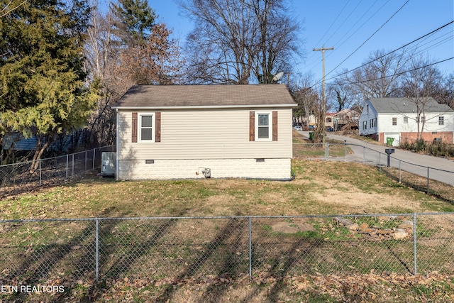 view of home's exterior with central AC unit and a lawn