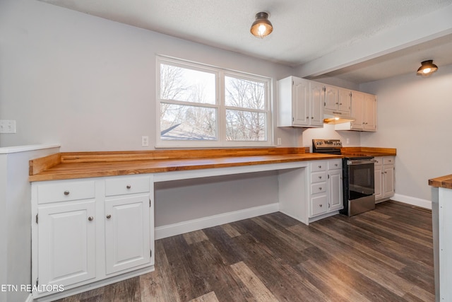 kitchen featuring wood counters, electric range, white cabinetry, and built in desk