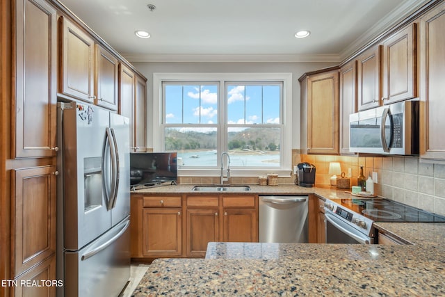 kitchen featuring sink, ornamental molding, light stone countertops, tasteful backsplash, and stainless steel appliances