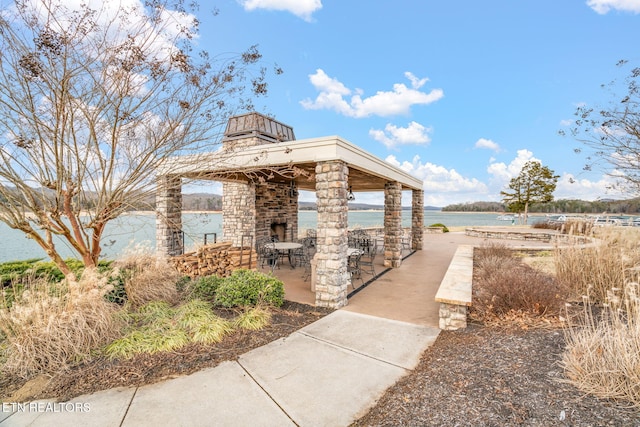 view of property's community featuring a gazebo and a water view