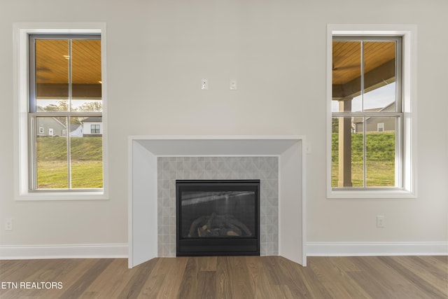 360 Poppy Pl, Lenoir City, TN 37772 - room details with baseboards, wood finished floors, and a fireplace