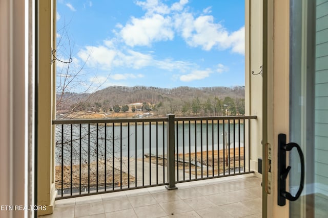 balcony with a water and mountain view