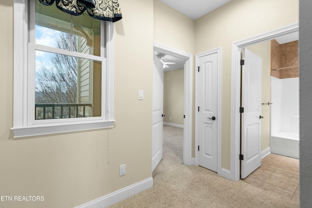 hallway with light carpet