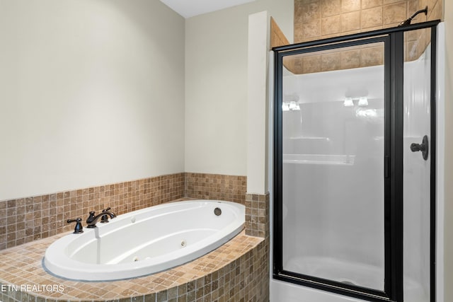 bathroom with separate shower and tub