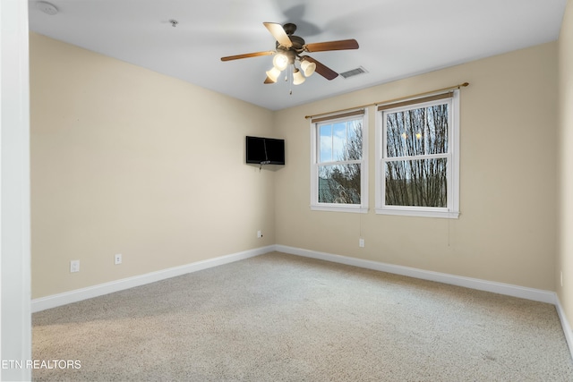 empty room with carpet and ceiling fan