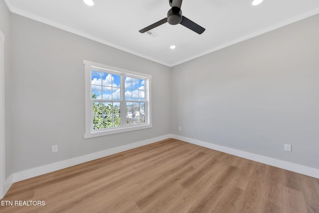 unfurnished room with crown molding, ceiling fan, and light hardwood / wood-style flooring