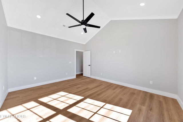 spare room with light hardwood / wood-style flooring, high vaulted ceiling, and ceiling fan