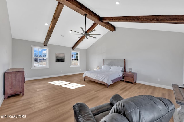 bedroom with light hardwood / wood-style flooring and vaulted ceiling with beams