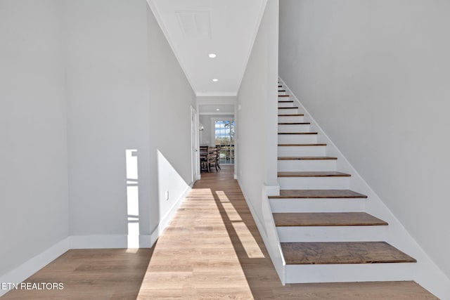 staircase featuring hardwood / wood-style flooring