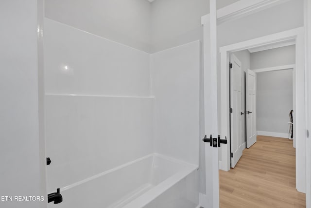 bathroom with hardwood / wood-style floors