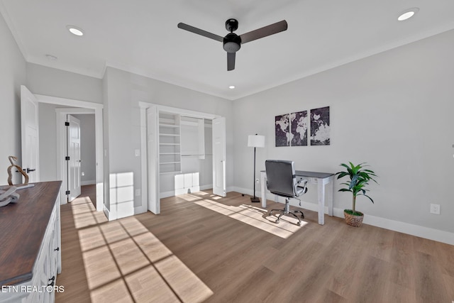 office area with light hardwood / wood-style floors and ceiling fan