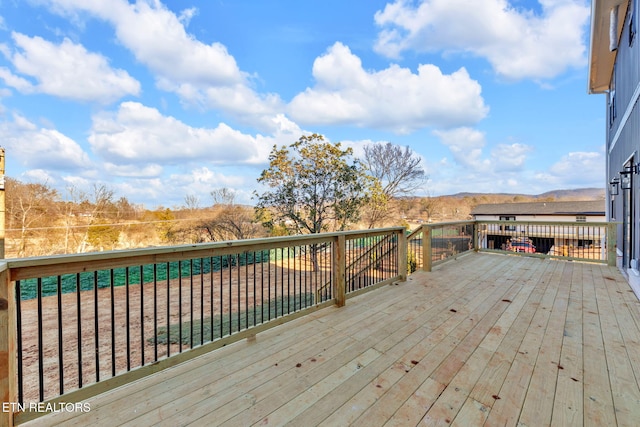 wooden terrace with a mountain view