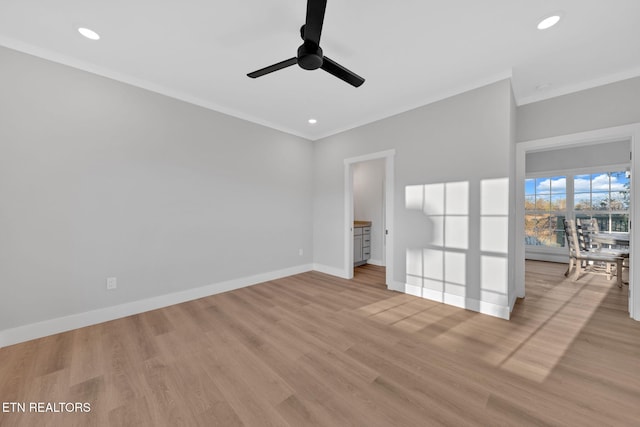 interior space featuring crown molding, ceiling fan, and light hardwood / wood-style flooring