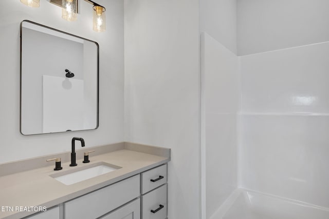 bathroom featuring vanity and bathing tub / shower combination