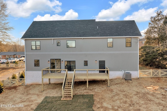 back of property featuring central AC and a deck