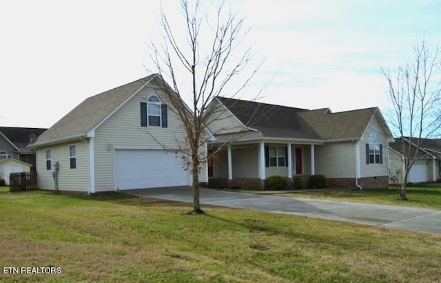 view of front of home featuring a garage and a front yard