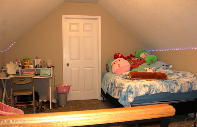 carpeted bedroom featuring lofted ceiling