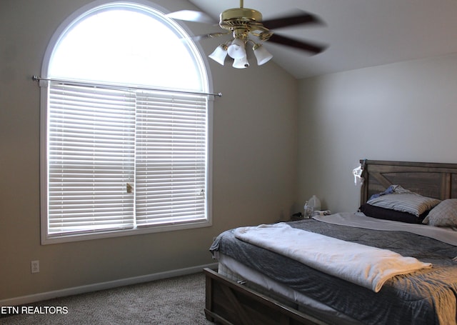 carpeted bedroom featuring ceiling fan and lofted ceiling