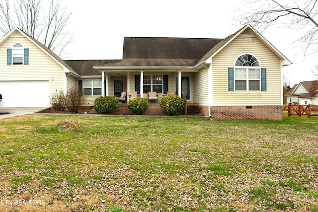 view of front facade featuring a porch, a garage, and a front yard